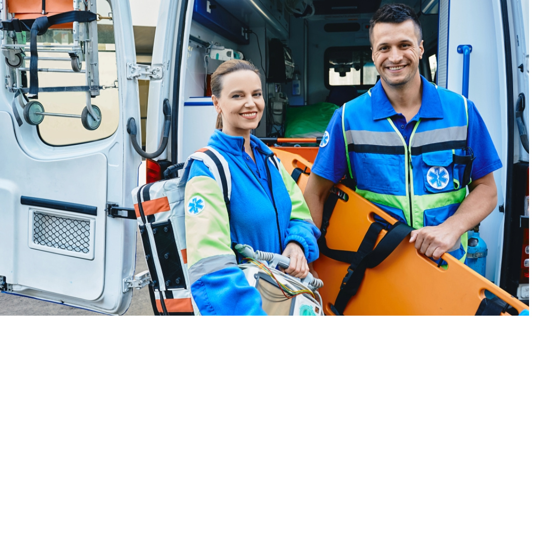 Two emergency medical responders standing next to an ambulance—CPR, First Aid, and BLS certification classes available in Tehama County for healthcare workers, first responders, and community safety programs.